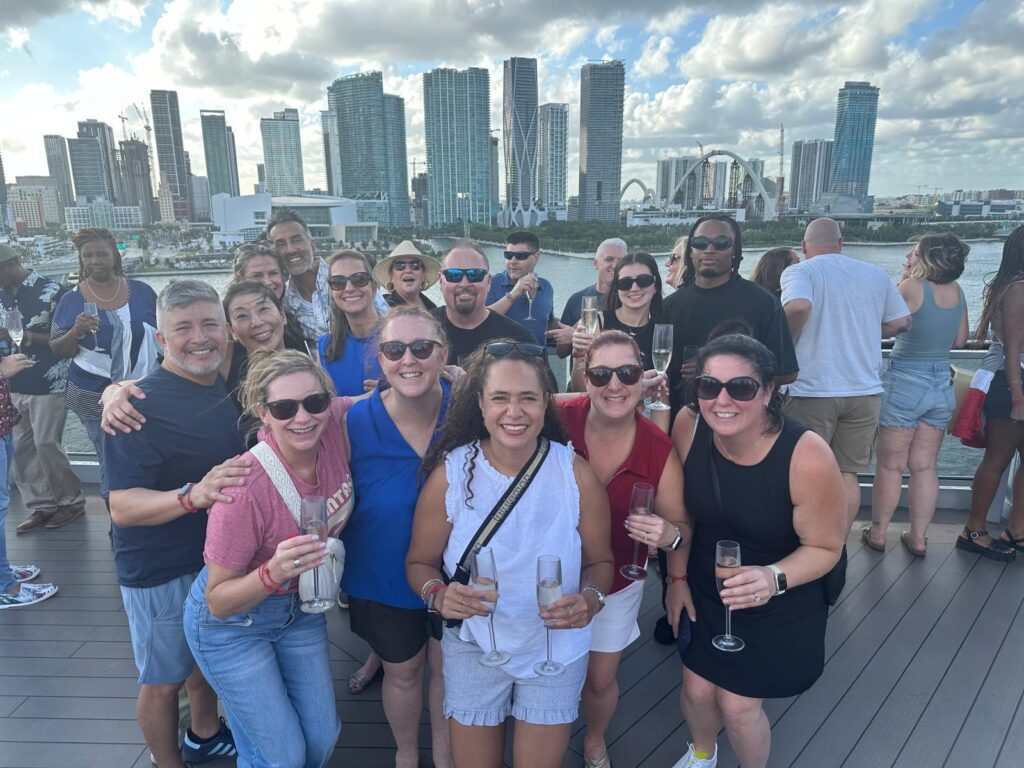 Toasting with champagne as the group trip cruise sails away from Miami