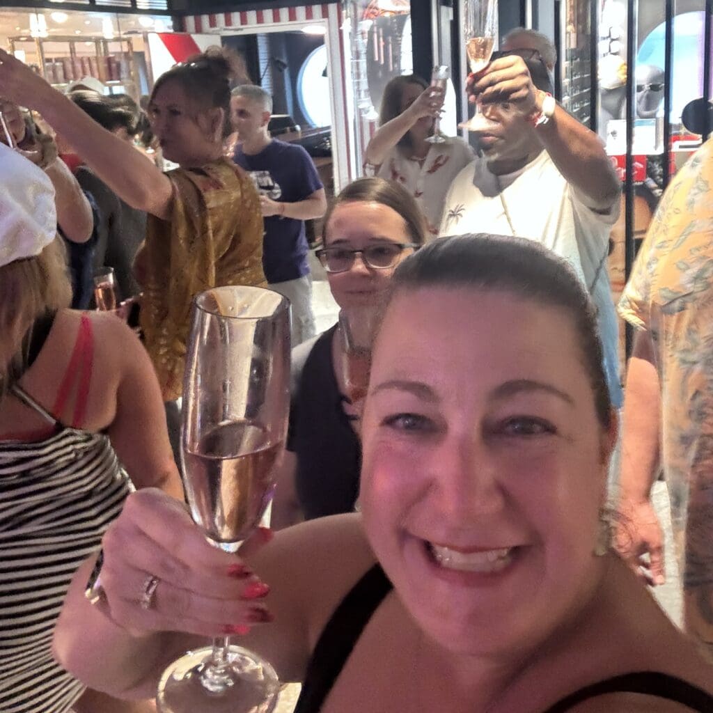 a solo cruising champagne toast during Virgin Voyages sail away party